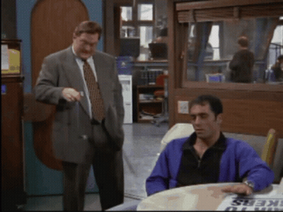Man In Purple Jacket At Workers Sign GIF
