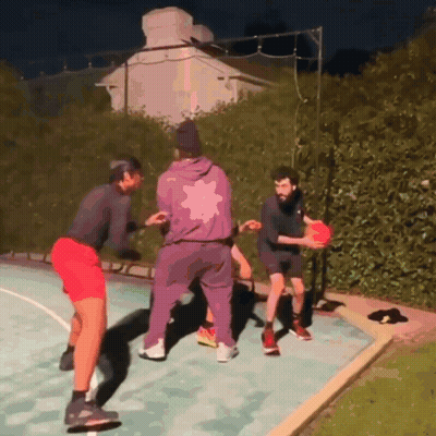 Man In Purple Jacket Playing Basketball GIF