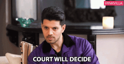 Man In Purple Jacket Sitting On Couch Court Will Decide GIF