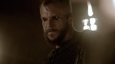 Man In Purple Jersey 70 At Crowded Bar GIF