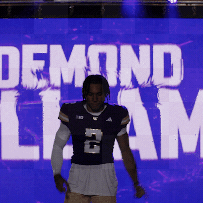 Man In Purple Jersey Number 2 In Front Of Demond Liam Screen GIF