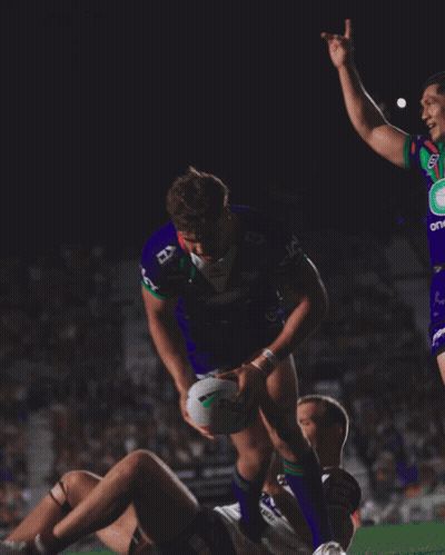 Man In Purple Jersey Number 7 Hugging Another Man GIF