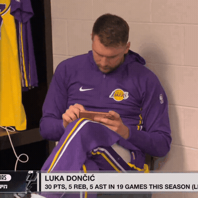 Man In Purple Lakers Jacket In Locker Room GIF