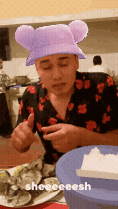 Man In Purple Mickey Ears Hat Eating Oysters GIF