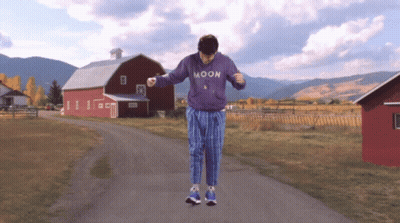 Man In Purple Moon Sweatshirt Dancing GIF