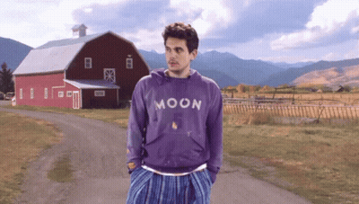 Man In Purple Moon Sweatshirt In Front Of Red Barn GIF