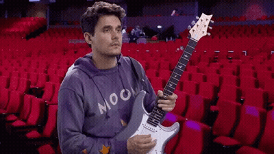 Man In Purple Moon Sweatshirt Playing Guitar GIF