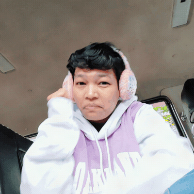 Man In Purple Oakland Sweatshirt And Ear Muffs GIF