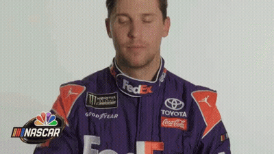 Man In Purple Orange Racing Suit Funny Face GIF