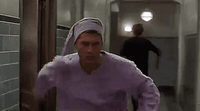 Man in Purple Pajama Top and Purple Hat
