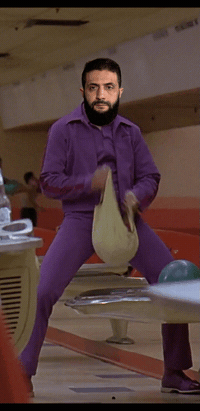 Man In Purple Pants Standing On Bowling Ball GIF