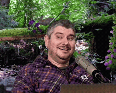 Man In Purple Plaid Shirt With Letter T GIF