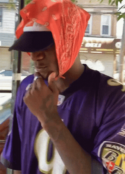 Man In Purple Ravens Jersey And Bandana GIF