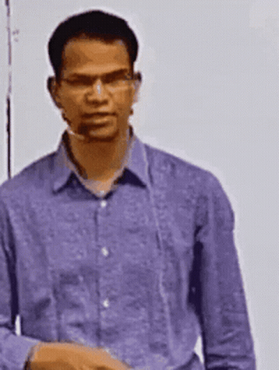 Man In Purple Shirt And Glasses Standing In Front Of Whiteboard GIF