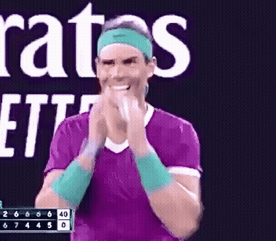 Man In Purple Shirt And Green Headband Clapping GIF