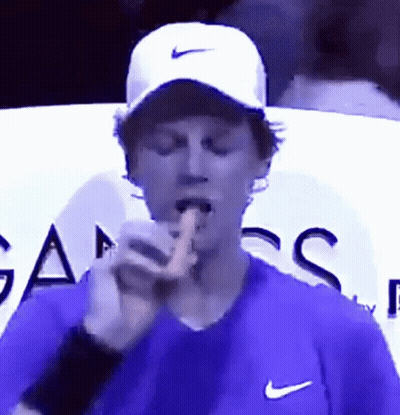 Man In Purple Shirt And White Nike Hat GIF