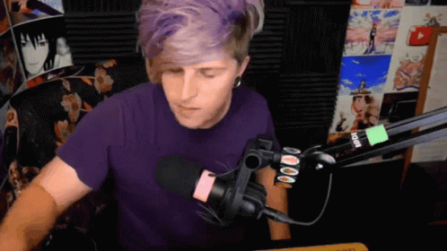 Man In Purple Shirt At Rode Microphone GIF