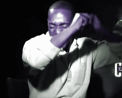 Man In Purple Shirt Covering Face GIF