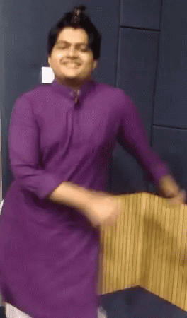 Man In Purple Shirt Dancing And Smiling GIF