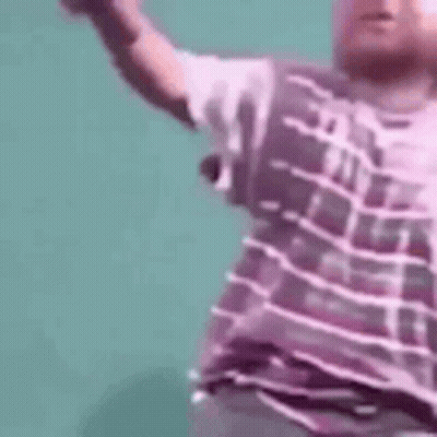 Man In Purple Shirt Dancing Arms Outstretched GIF
