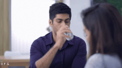 Man In Purple Shirt Drinking From Glass GIF