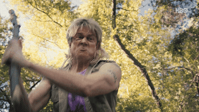 Man In Purple Shirt Holding Sword With HBO Logo GIF
