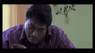 Man In Purple Shirt Looking At Something GIF