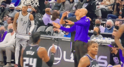 Man In Purple Shirt Next To Basketball Player GIF