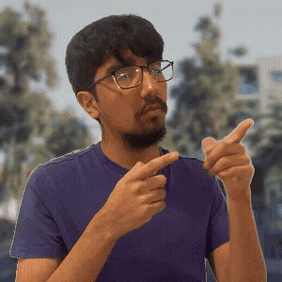 Man In Purple Shirt Pointing GIF