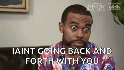 Man In Purple Shirt Saying I Aint Going Back And Forth GIF