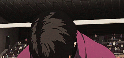 Man In Purple Shirt Standing In Stadium GIF
