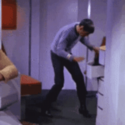 Man In Purple Shirt Standing GIF