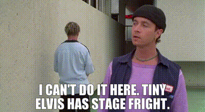 Man In Purple Shirt Talking To Man In Blue Shirt GIF