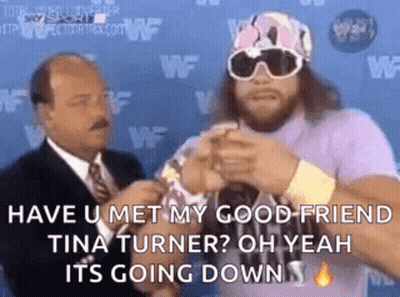 Man In Purple Shirt Talking To Suit GIF