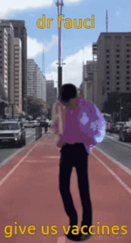 Man In Purple Shirt Walking City GIF
