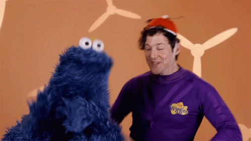 Man In Purple Shirt Wiggles GIF