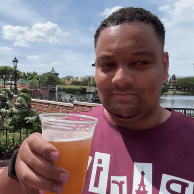 Man In Purple Shirt With Letter I GIF