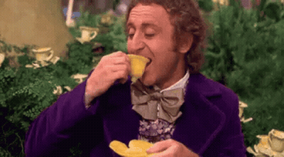 Man In Purple Suit And Bow Tie Drinking Tea GIF