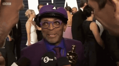 Man In Purple Suit And Hat Interviewed By BBC GIF