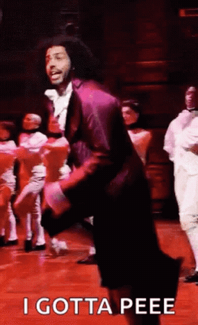 Man In Purple Suit Dancing On Stage GIF