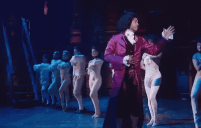 Man In Purple Suit Dancing On Stage GIF