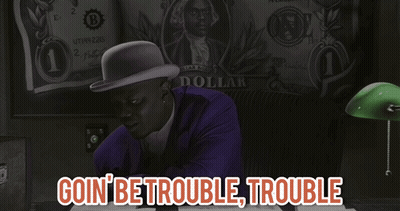 Man In Purple Suit Sitting In Front Of Dollar GIF
