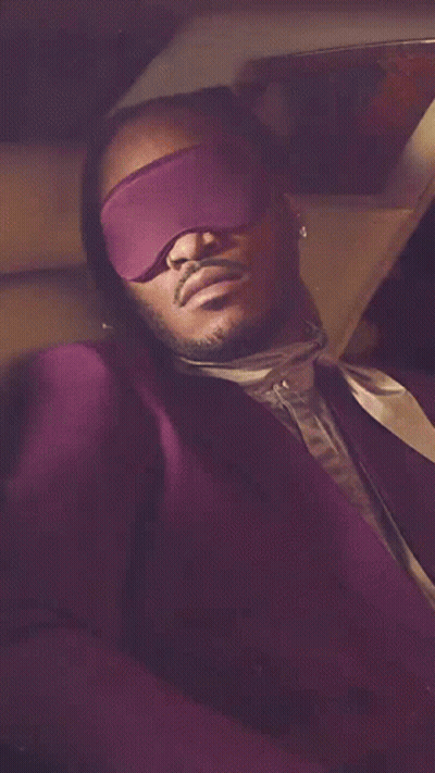 Man In Purple Suit With Blindfold GIF