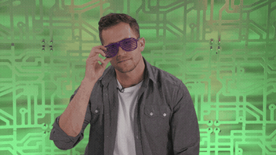 Man In Purple Sunglasses On Green Background GIF