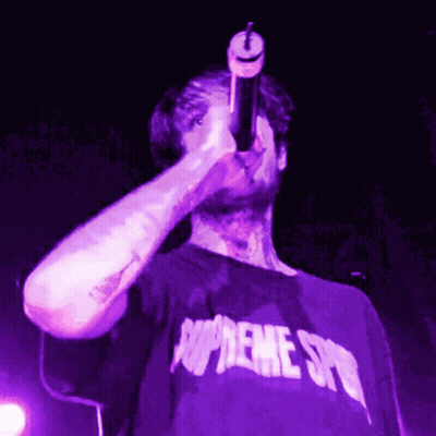 Man In Purple Supreme Shirt Singing Into Microphone GIF