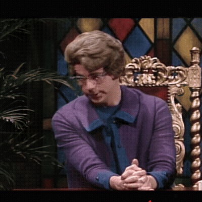 Man In Purple Sweater With Folded Hands GIF