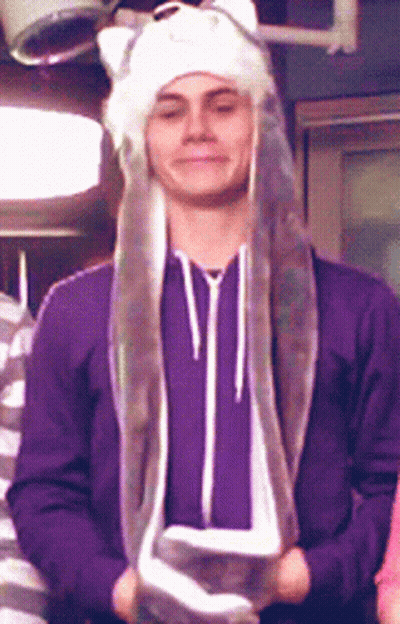 Man In Purple Sweatshirt And White Hat With Ears GIF