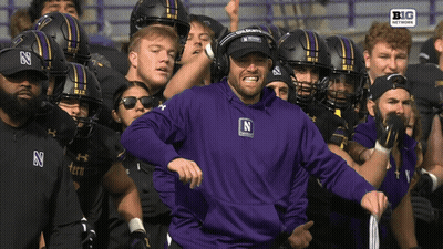 Man In Purple Sweatshirt With Letter N GIF
