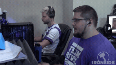 Man In Purple Team Rive Shirt Sitting Next To Another Man GIF
