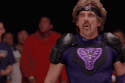 Man In Purple Throwing Ball At Lumber Liquidators GIF